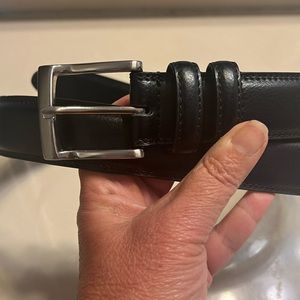 Florsheim black leather belt with silver tone buckle. Size 40
